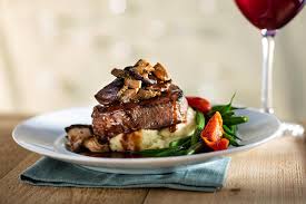 Seasons 52 signature dishes Wood-grilled Filet MignonAsian-glazed Chilean Sea BassAhi Tuna TartareCedar Plank-roasted Salmon